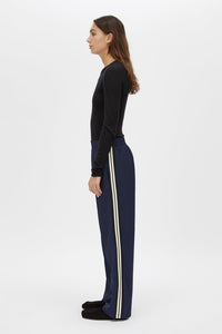 Side view CAMILLA AND MARC Barre Long Sleeve Top in Black with slim silhouette.