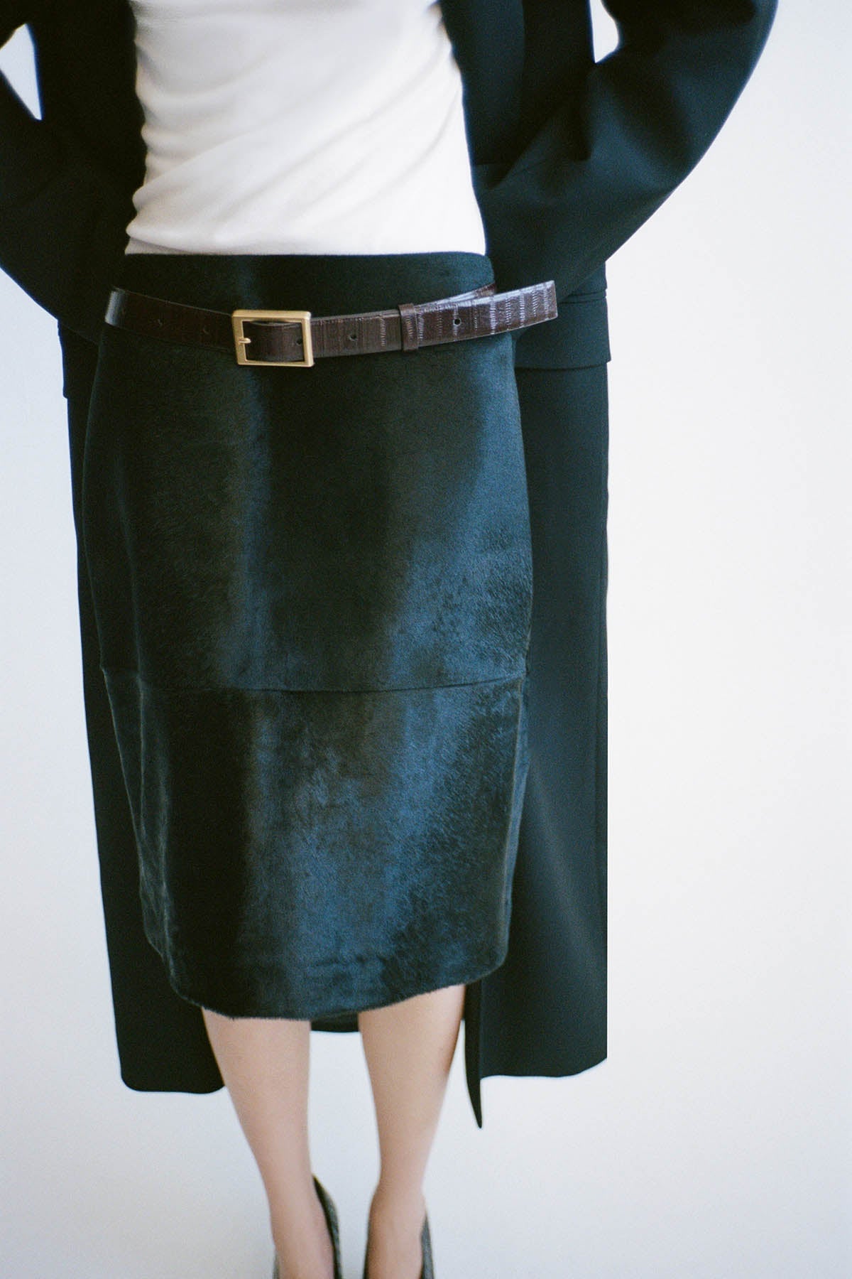 Styled view CAMILLA AND MARC Contour Leather Skirt in Black with mid‑rise, pencil fit.