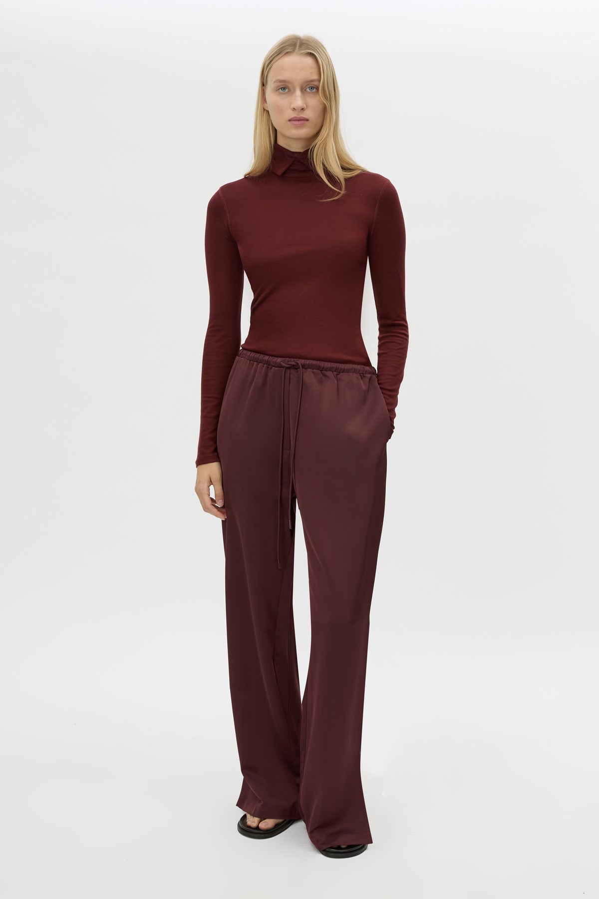 Front view CAMILLA AND MARC Barre High Neck Top in Burgundy with long sleeves and V‑neck split turtleneck.