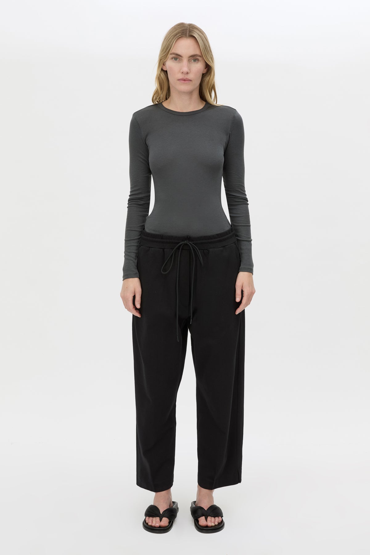 Front styled view CAMILLA AND MARC Beau Tapered Crop Pant in Black with elasticated waistband.