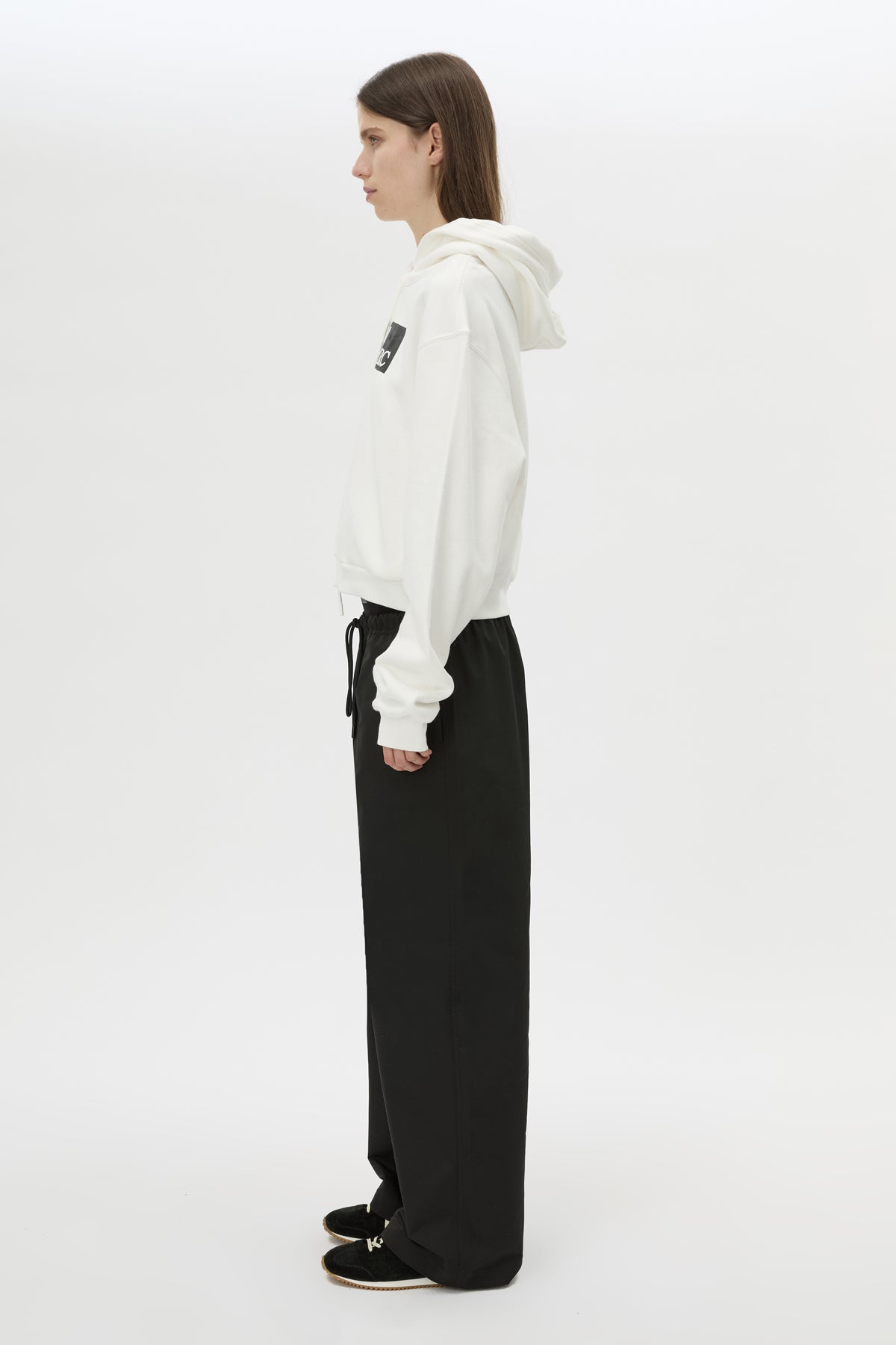 Side view CAMILLA AND MARC Carmont Graphic Hoodie in Soft White with boxy fit and black graphic logo.