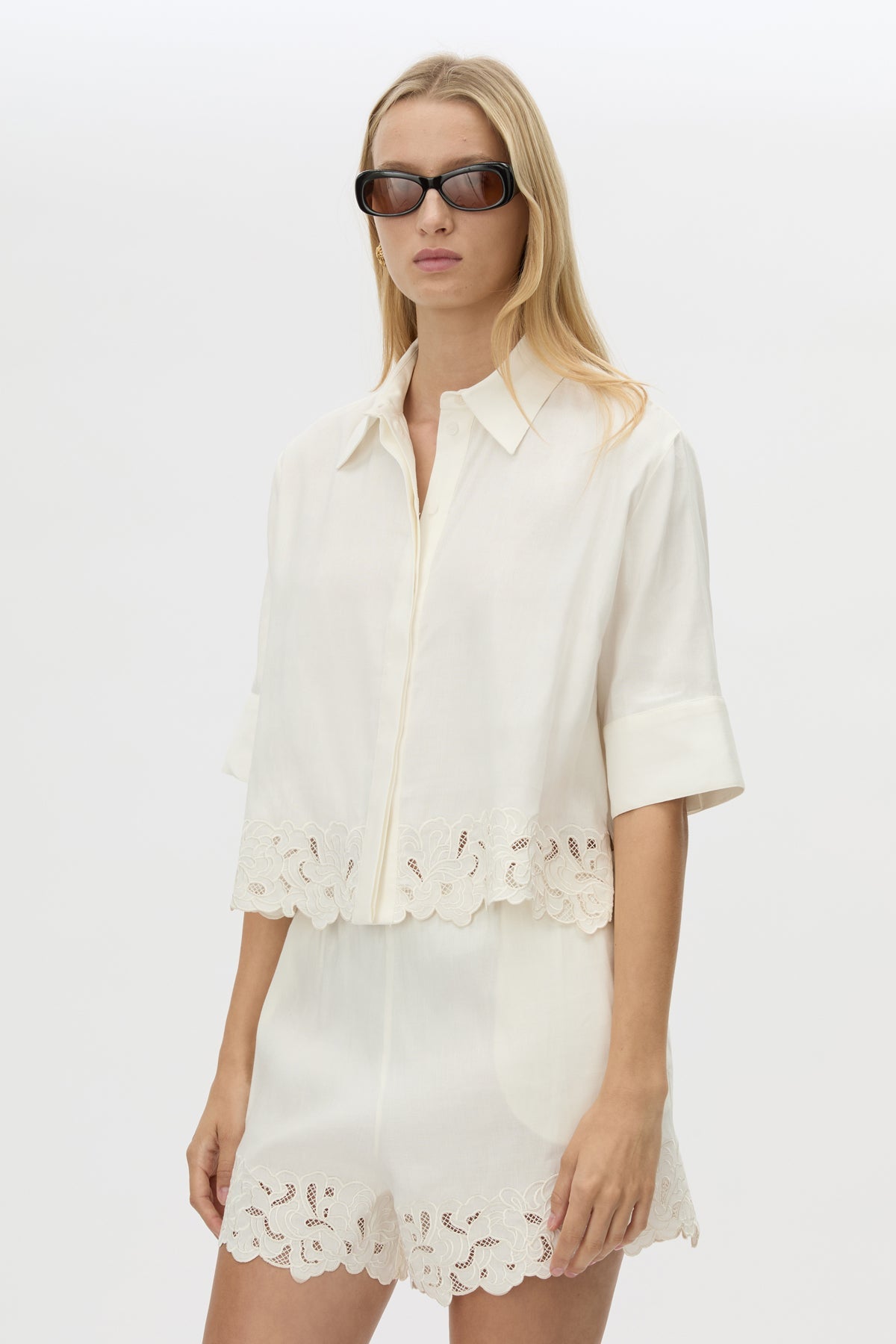 Cropped view CAMILLA AND MARC Chara Embroidered Cropped Shirt in Cream with short sleeves, lace hem and slight A‑line fit.
