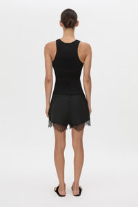 Back view CAMILLA AND MARC Chiaro Mini Short in black with lace hem detail.