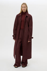 Front view CAMILLA AND MARC Dia Trench Coat in Burgundy styled open.