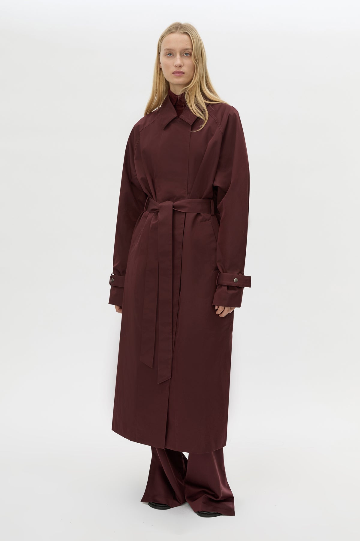 Front view CAMILLA AND MARC Dia Trench Coat in Burgundy with long‑line cut.