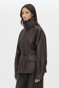 Cropped view CAMILLA AND MARC Drea Puffer Jacket in Espresso Brown with funnel neck and padded puffer silhouette.