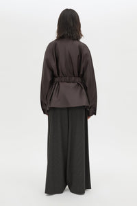 Back view CAMILLA AND MARC Drea Puffer Jacket in Espresso Brown with funnel neck and padded puffer silhouette.