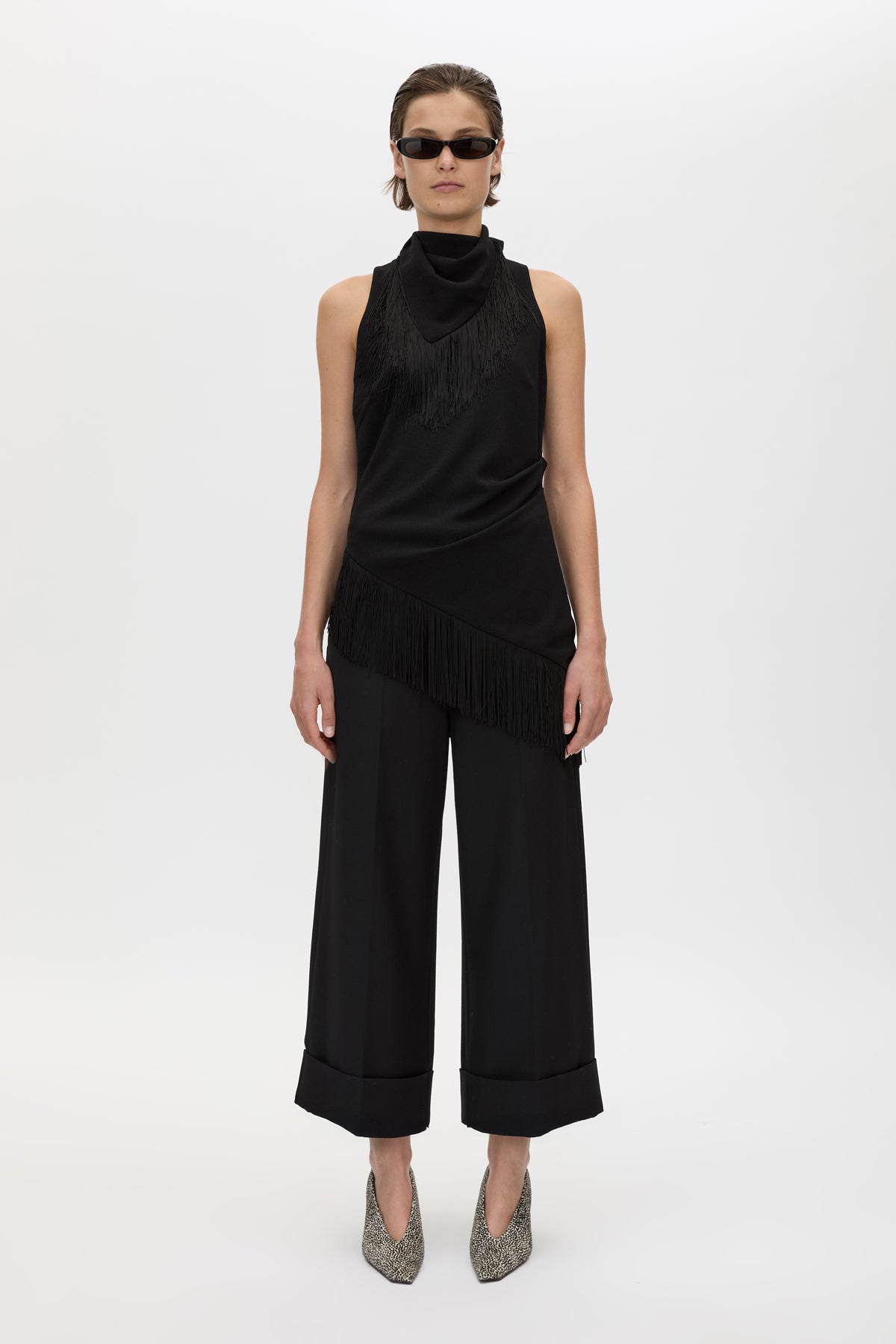 Front view CAMILLA AND MARC Dune Fringe Top in Black with asymmetric cut, gathered waist, high neck and fringe scarf.