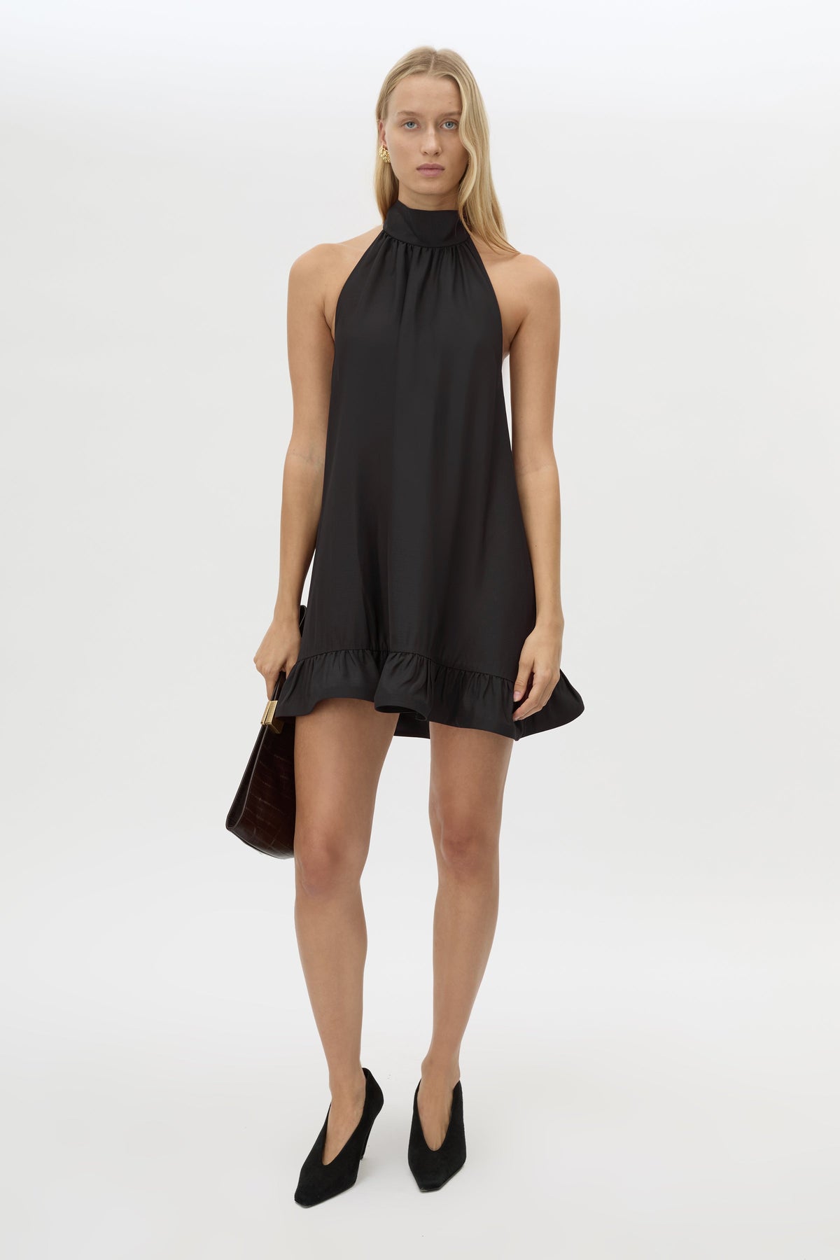 Front styled view CAMILLA AND MARC Elsen Halter Mini Dress in Black with open back, tie‑up neck and fluted crinoline hem.