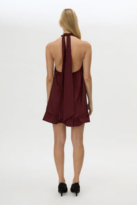Back view CAMILLA AND MARC Elsen Halter Mini Dress in Burgundy with open back, tie‑up neck and fluted crinoline hem.