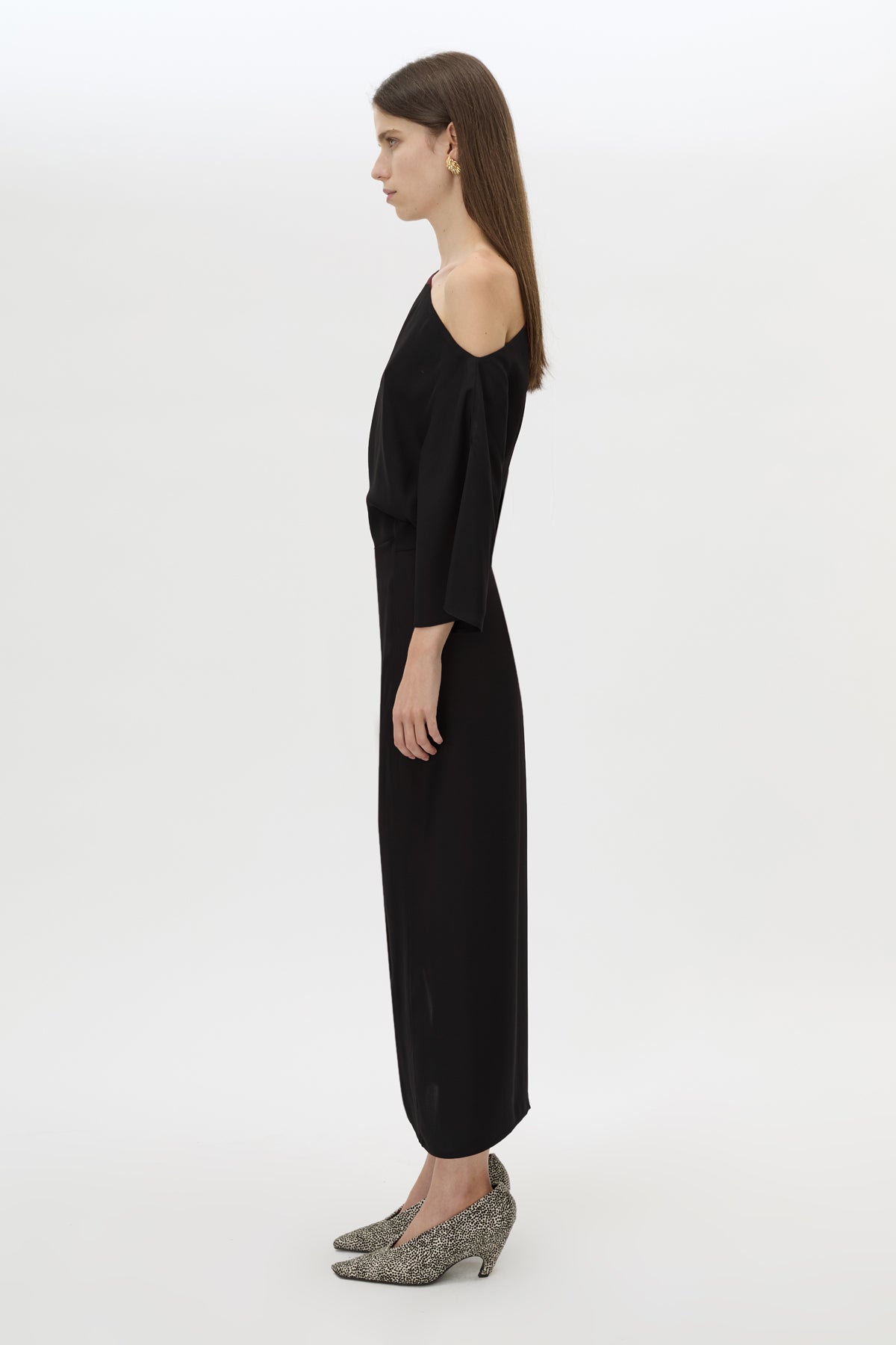 Side view CAMILLA AND MARC Elsen Off Shoulder Midi Dress in Black with asymmetric neckline.