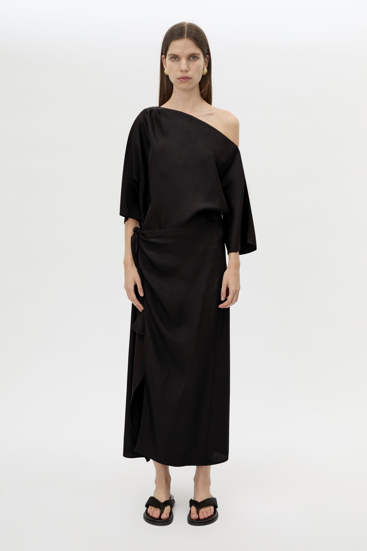 Front styled view CAMILLA AND MARC Elsen Off Shoulder Midi Dress in Black with asymmetric neckline.