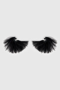 Side view CAMILLA AND MARC Friesian Feather Earrings in Black featuring sculptural soft‑spike hoops fitted with black faux ostrich feathers.