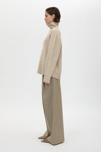 Side view CAMILLA AND MARC Leonie Turtleneck Knit Sweater in Oatmeal Marle with relaxed fit, ribbed collar and ribbed hems.