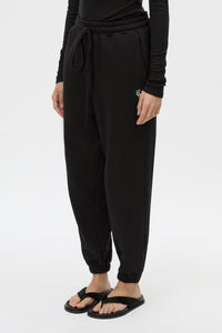 Cropped view CAMILLA AND MARC Lyra Logo Track Pant in Black and White with relaxed fit and embroidered initial detail.