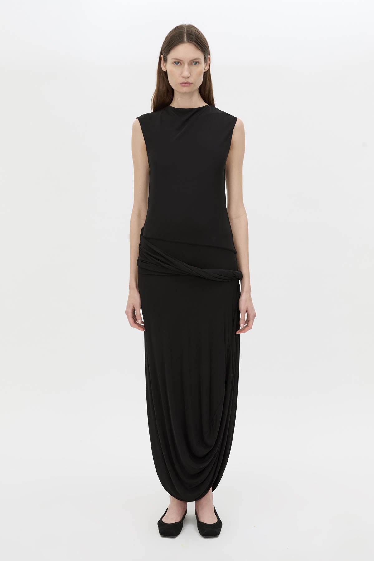 Front view CAMILLA AND MARC Myro Midi Dress in black with a fitted waistline and a twisted drape detail at the hip.