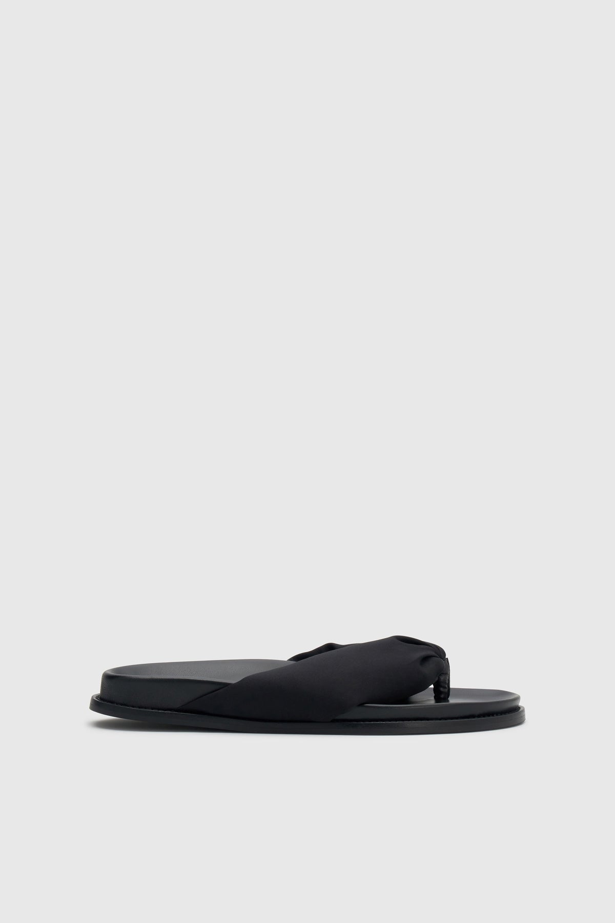 Side view CAMILLA AND MARC Nina Slide Sandal in Black with padded satin straps.