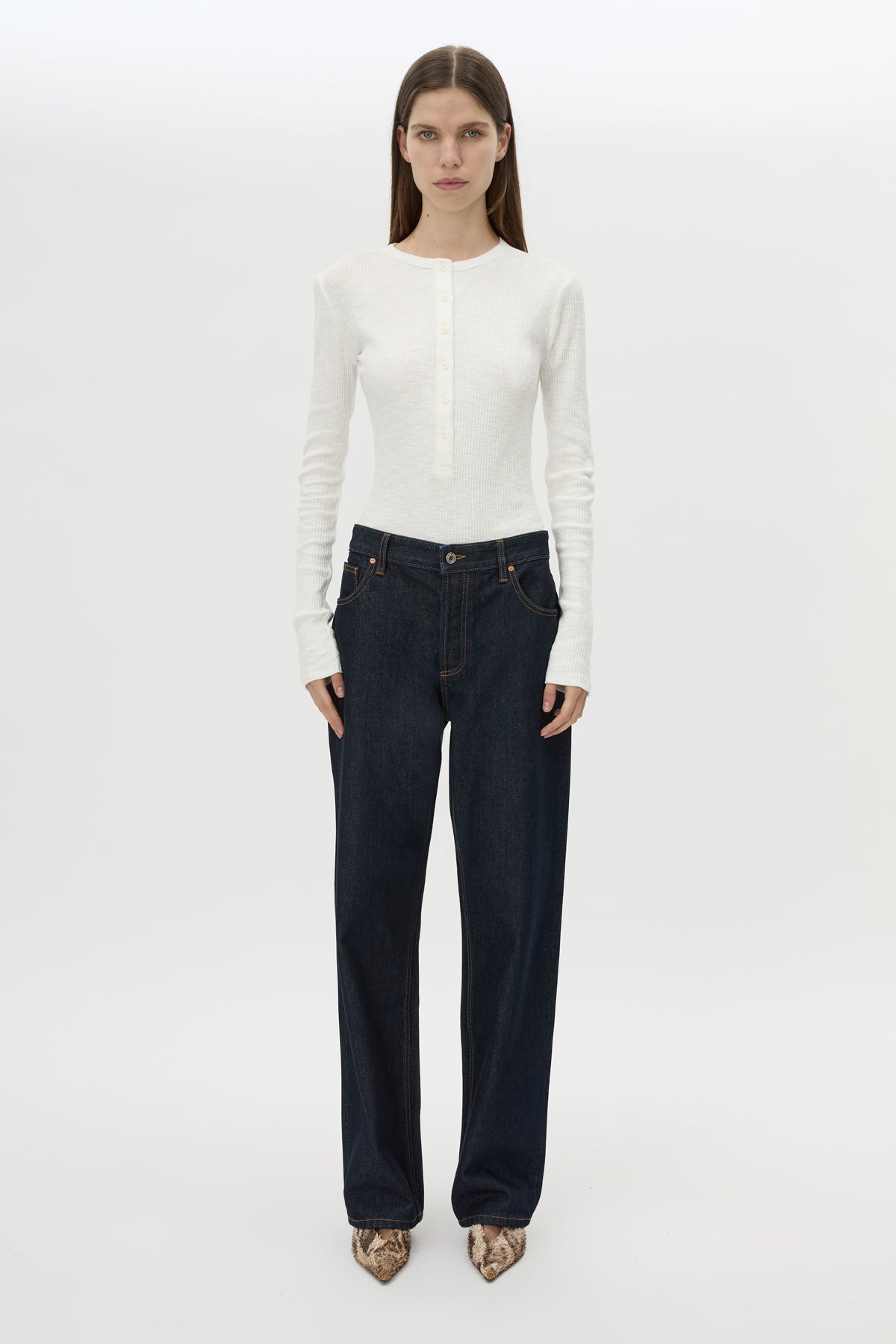 Front styled view CAMILLA AND MARC Orion Slub Jersey Bodysuit in White with long sleeves, and rib button placket.