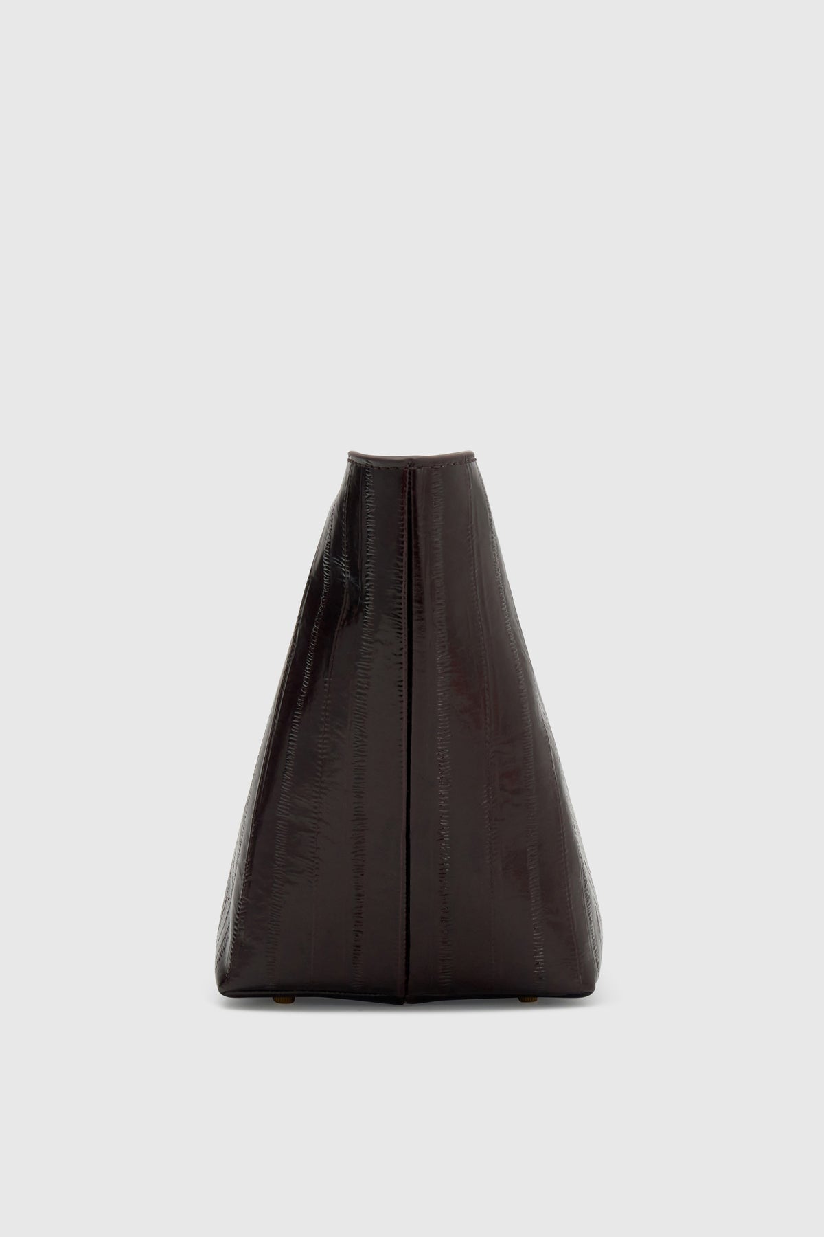 Side ghost view CAMILLA AND MARC Poppy Eel Clutch in Burgundy eel‑embossed leather with ribbed gold hardware.