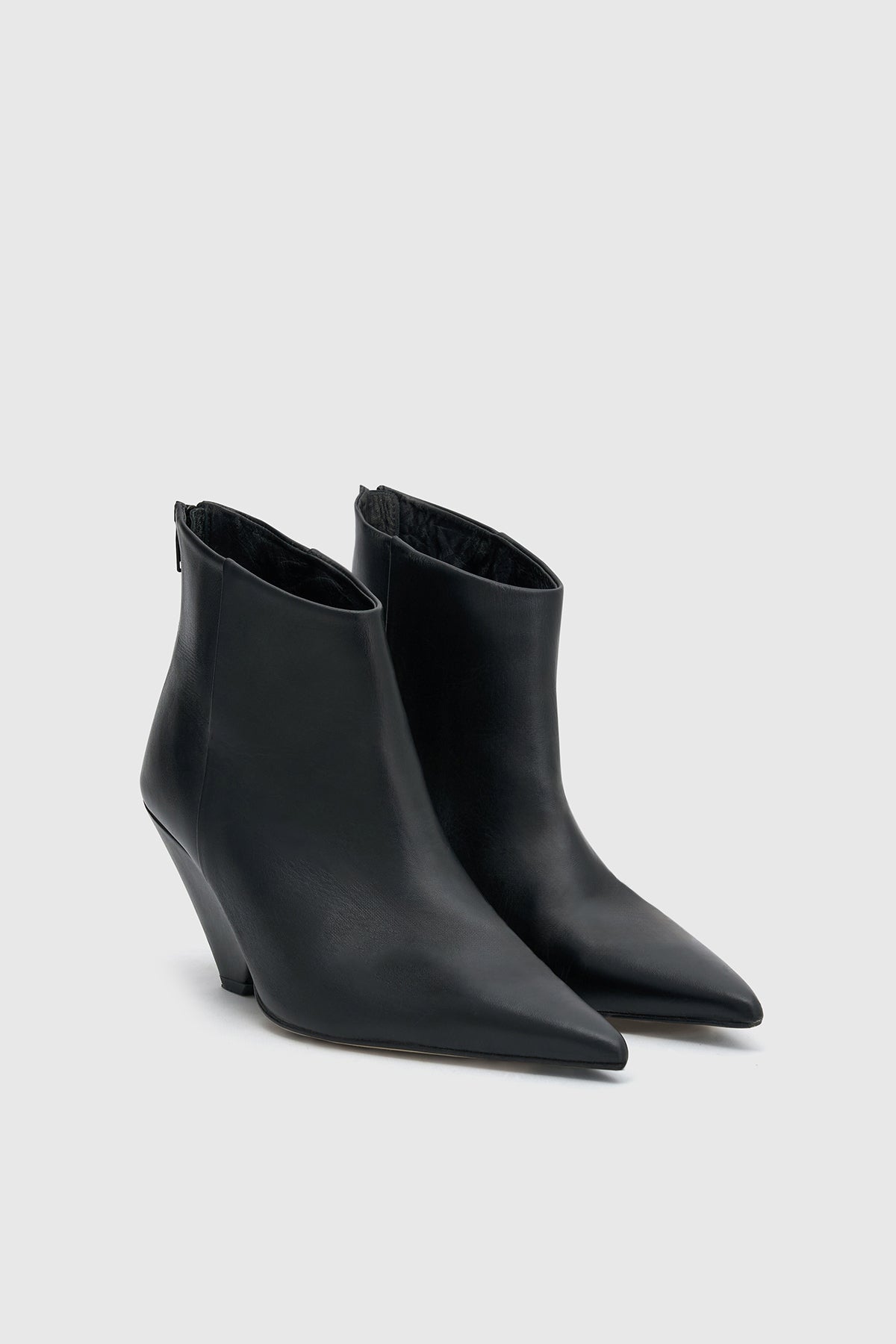 Three-quarter view CAMILLA AND MARC Rhys Boot in Black featuring Italian leather and a pointed pump‑boot silhouette.  