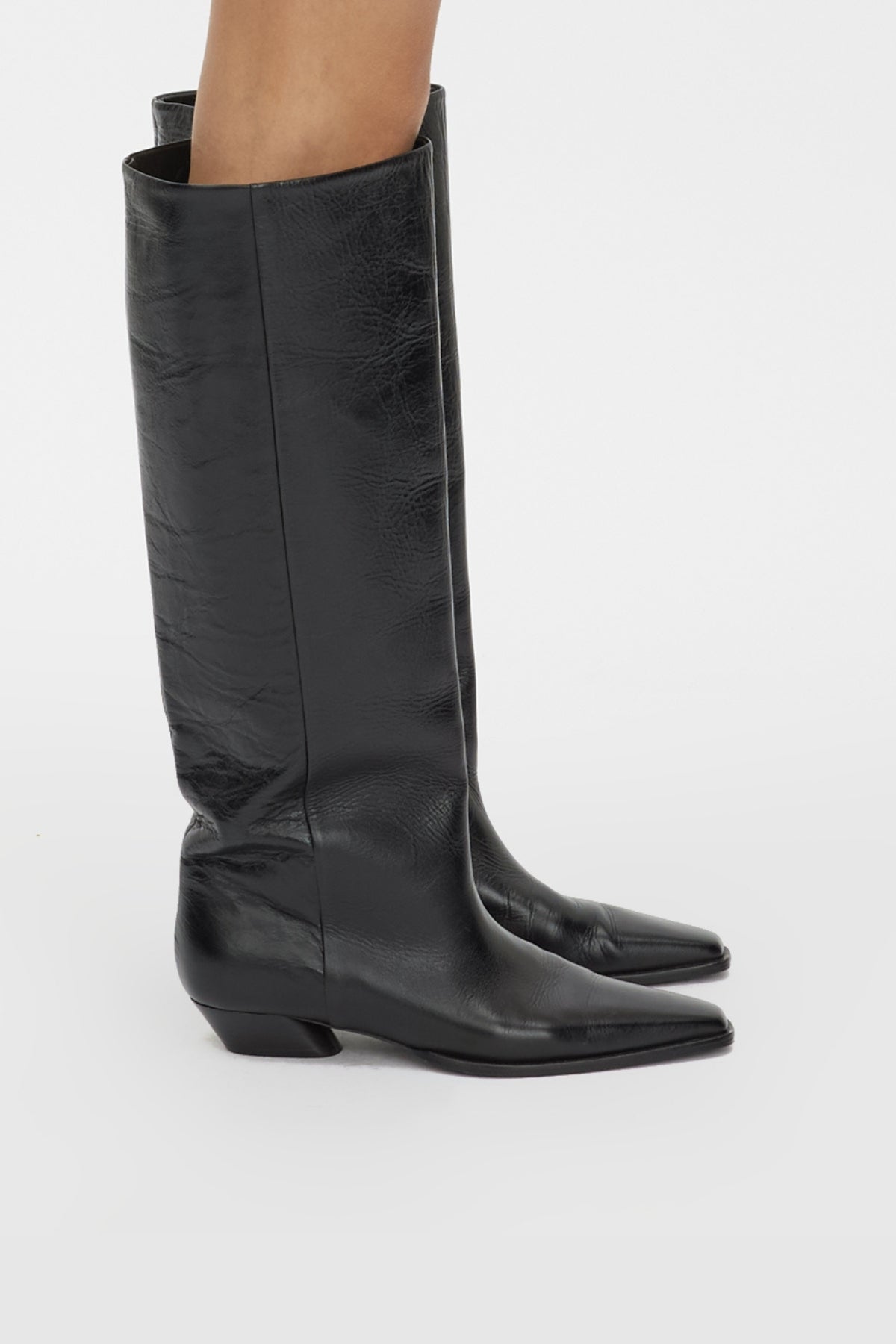 Side view CAMILLA AND MARC Rowan Knee Boot in Black tumbled‑look Italian cow leather.