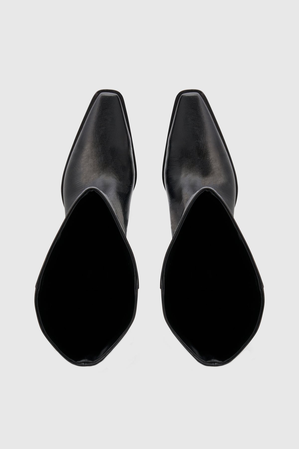 Top ghost view CAMILLA AND MARC Rowan Knee Boot in Black tumbled‑look Italian cow leather.