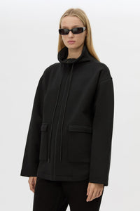 Cropped view CAMILLA AND MARC Salem Bonded Fleece Jacket in black with high collared neckline.