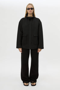 Front styled view CAMILLA AND MARC Salem Bonded Fleece Jacket in black with high collared neckline.