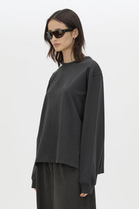 Cropped view CAMILLA AND MARC Studio Graphic Long Sleeve Top in Grey with boucle embroidered monogram.  