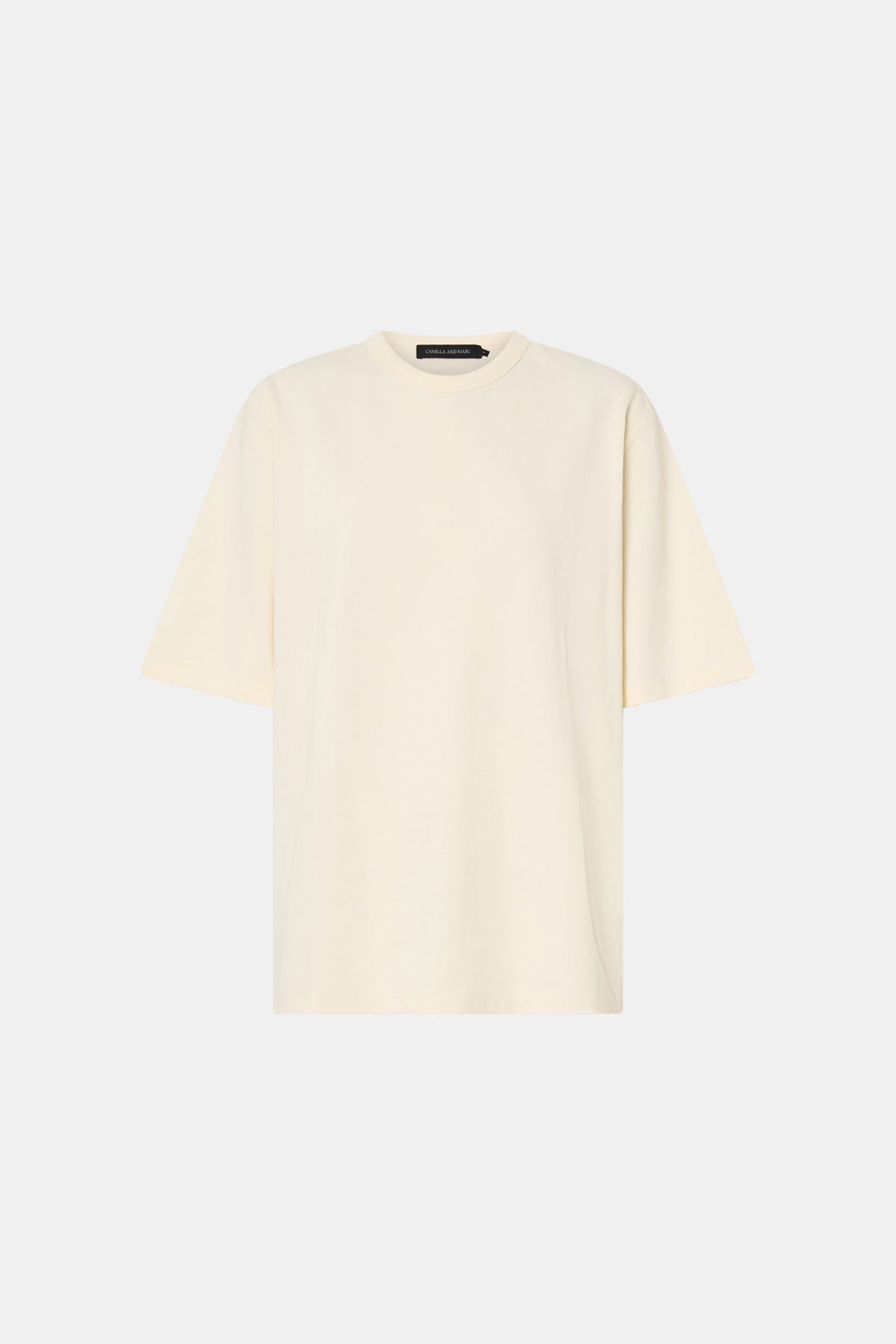 Ghost view CAMILLA AND MARC Studio Graphic Tee in White with short sleeves and boucle embroidered monogram.  