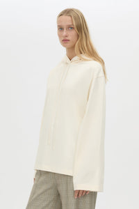 Cropped view CAMILLA AND MARC Studio Hoodie in White with relaxed long‑sleeve design and hooded silhouette.  