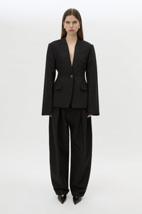 Front styled view CAMILLA AND MARC Tala Fitted Collarless Blazer in Black with single‑breasted closure, curved sleeves 