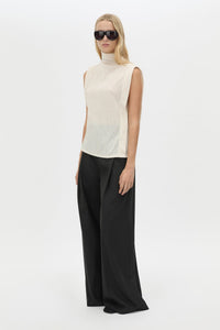Three-quarter view CAMILLA AND MARC Talo Jersey Top in Cream with a boxy sleeveless cut.