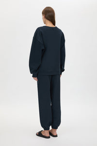 Back view CAMILLA AND MARC Tia Flocking Logo Crew in Deep Ink with relaxed fit, logo artwork and 100% cotton.