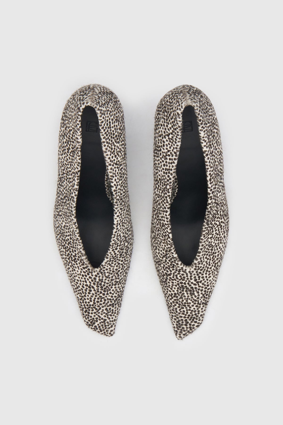 Top view CAMILLA AND MARC Wave Spotted Pump in Black and White with textured finish and angled heel.