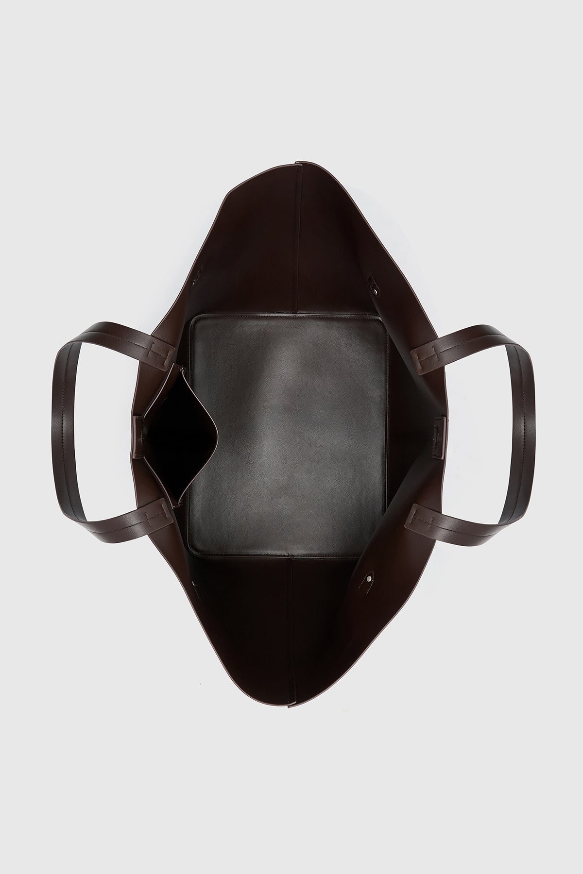 Top view CAMILLA AND MARC Willa Tote in Chocolate Brown with side strap and buckle detailing and magnetic button closure.