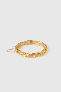 Front view CAMILLA AND MARC Wrenley Bangle with worn‑look 18k gold plating featuring an interlocking chain design.